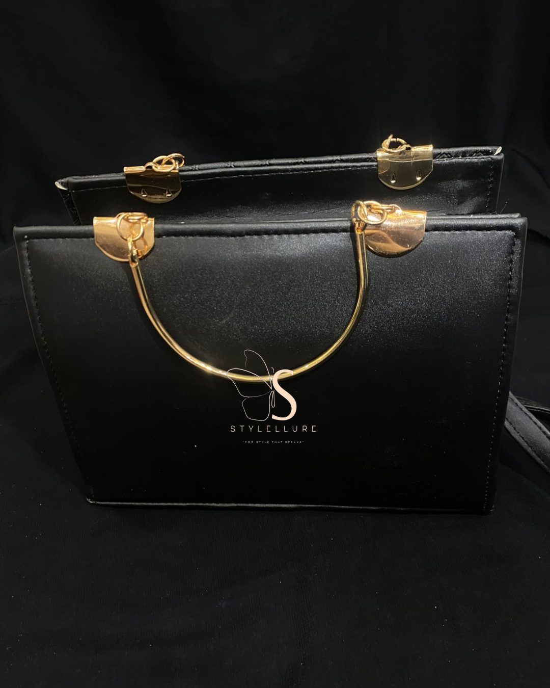 Stylish black Handbag with golden tone